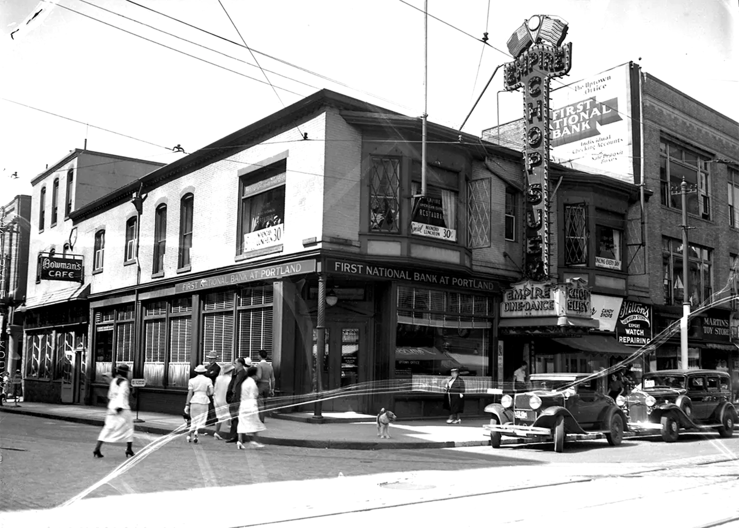 Photo of the Empire Comedy Club showroom with tables, chairs, and the stage.